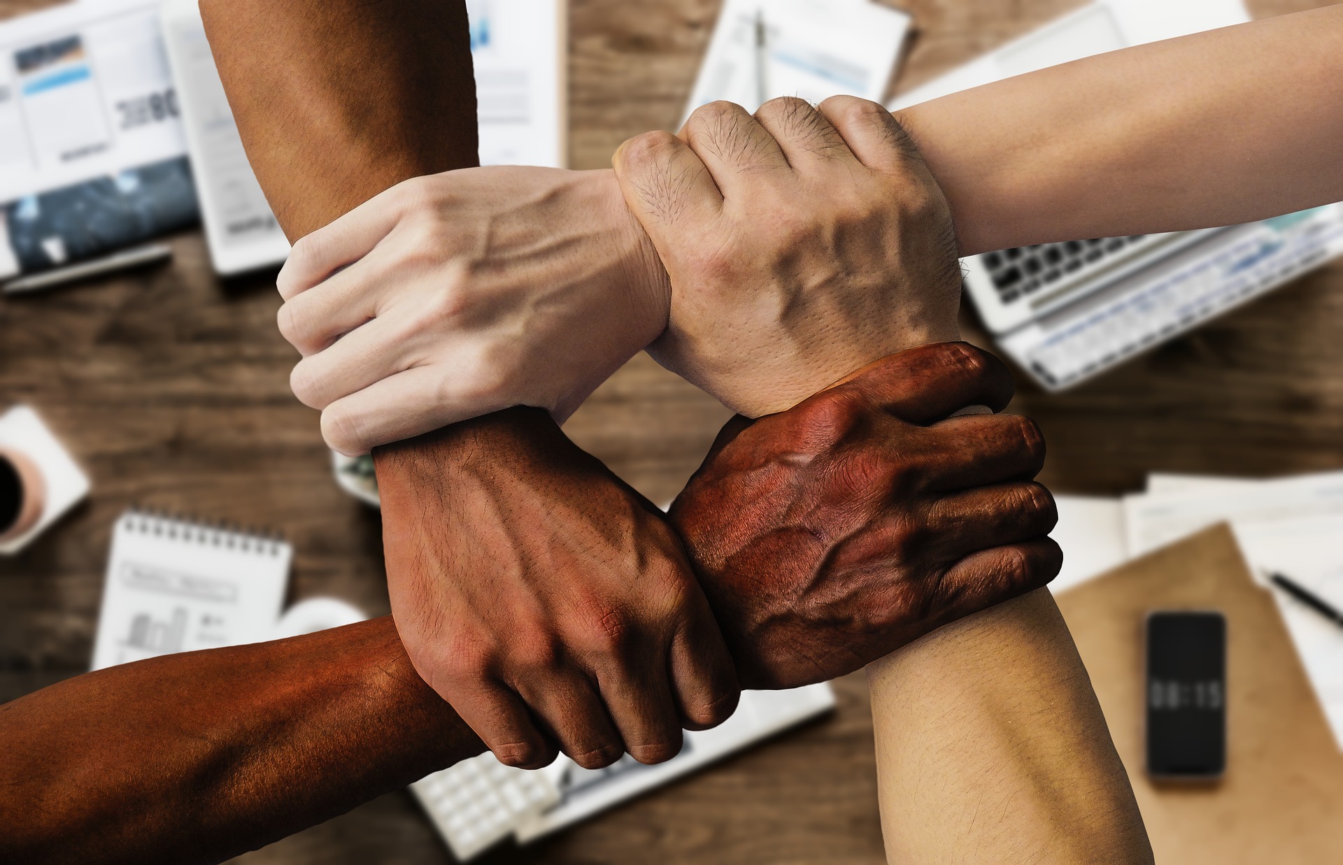 hands holding wrists building connections