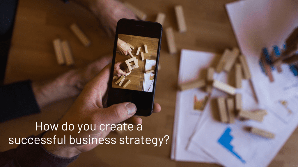 person looking at an image of someone playing jenga through their smartphone